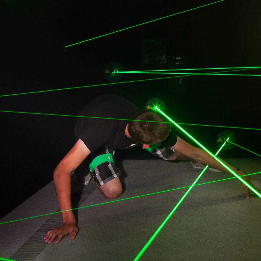 Boy in black shirt in laser maze